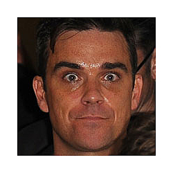 Robbie Williams Storms UK Album Chart
