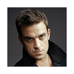 Happy hermit Robbie Williams