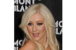 Christina Aguilera looks like Marilyn Monroe as she advertises her perfume - The newly single pop star showed off a curly blonde hairstyle and full red lips to promote her &hellip;