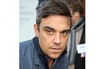 Robbie Williams so scared he `kept pistol under pillow` - The 36-year-old star said it was during his time with band Take That that he was frightened for his &hellip;