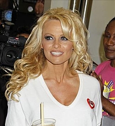 Pamela Anderson spotted enjoying a pint