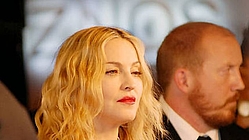 Madonna `does yoga in airplane aisle`