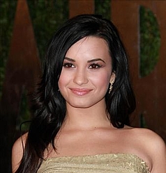 Demi Lovato settles with back-up dancer she allegedly punched