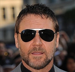 Russell Crowe reveals a bushier beard as he defends his Aussie rugby club