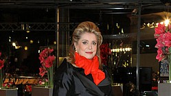 Catherine Deneuve outfoxes a bevy of world class beauties, at 70