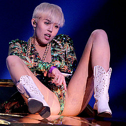Miley Cyrus sued by worker &#039;severely injured&#039; by giant Bangerz tongue