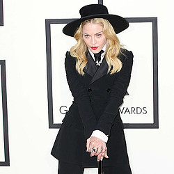 Madonna waves goodbye to orphans in Malawi with hand sanitiser