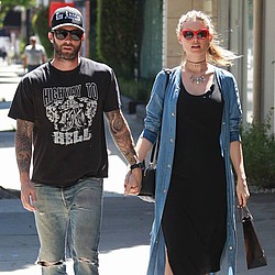 Adam Levine publicly celebrates wife and baby for first time