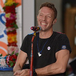 Chris Martin signs divorce papers