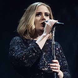 Adele delights fans at tour kick off