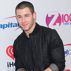 Nick Jonas charmingly evades Lily Collins romance questions