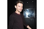 Louis Tomlinson shares first snap of son - Louis Tomlinson has shared the first photo of his newborn son.The One Direction star became a first &hellip;