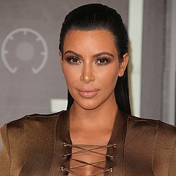 Kim Kardashian: Kanye&#039;s calmed me down