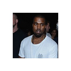 Kanye West attacks paparazzo