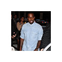 Kanye West hugs it out with paparazzo