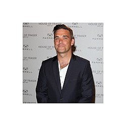 Robbie Williams gives lap dance