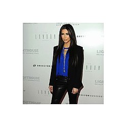 Kim Kardashian ‘to travel with Kanye’