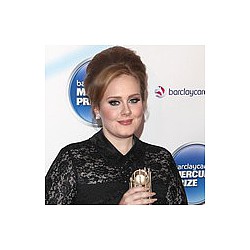 Adele enjoys close romance
