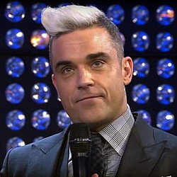 Robbie Williams and Gary Barlow reunite at Heroes Concert