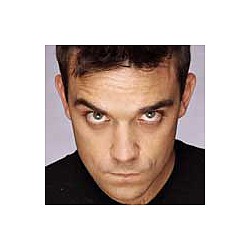 Robbie Williams smokes rubber