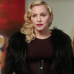 Madonna jets off with new lover