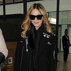Madonna&#039;s son returns to New York amid custody battle