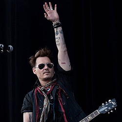 Johnny Depp parties like a rock star amid divorce battle