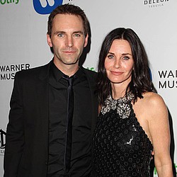 Courteney Cox and Johnny McDaid seal reunion with a kiss