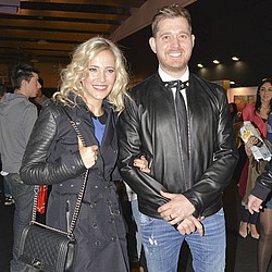 Michael Buble and wife take turns working
