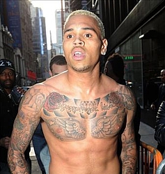 Chris Brown apologises for `smashing window`
