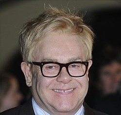 Elton John performing with his former waiter at festival