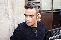 Robbie Williams `splits his pants with excitement`