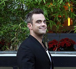 Robbie Williams greets X Factor wannabes naked