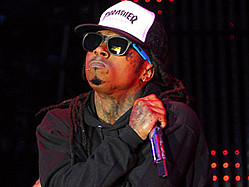 Lil Wayne Holds On To Top Billboard Spot