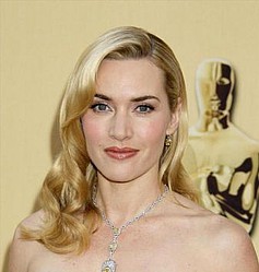 Kate Winslet `gets stuck into beau over dinner`