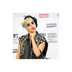 Lady Gaga chooses risqué headwear for promo