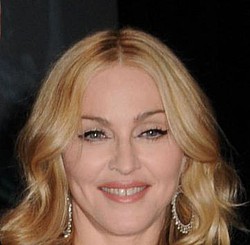 Madonna signs three-album deal
