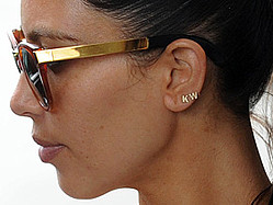Kim Kardashian Sports Kanye West Earrings On NYC Date