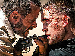 Robert Pattinson Finds Himself Under The Gun Again In &#039;The Rover&#039;