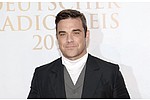 Robbie Williams&#039; tattoo tribute to daughter - Robbie Williams has gotten a tattoo in tribute of his daughter. The &#039;Candy&#039; hitmaker has added some &hellip;